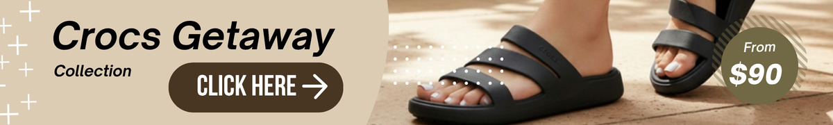 a banner showing Crocs black getaway sandals slide on feet to direct users to the getaway collection