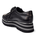 The Django & Juliette Eammes Black Leather Platform Shoe for women features black leather, black laces, and thick striped black and gray soles, shown from the back on a white background., 51089, 4434754993411, 4434756993428, 4434754993435, 4434754993442, 4434754993459, 51095
