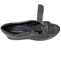 The Django & Juliette Ellore Charcoal Grey Leather Platform Shoe for women is shown from above on a white background with its hook-and-loop strap partially open, revealing the insole and size “38.”., 51103, 4434754334016, 4434754334023, 4434754334030, 4434754334047, 4434754334054, 4434754334061