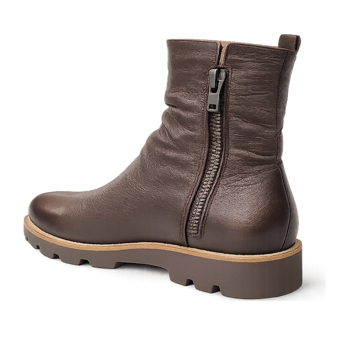 The Django & Juliette Dixeya Chocolate Leather Boot features a chunky rubber sole, visible side zipper, and slightly textured finish—photographed from a back angle, it's an essential in women's leather ankle boots., 51117, 4434754329746, 4434754329753, 4434754329760, 443475432977, 4434754329784, 4434754329791