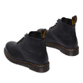 The Dr Martens 101 UB Black Ambassador 6 Eye Leather Boot features black leather, yellow stitching around the soles, and black pull tabs, shown from the back on a white background., 190665693683, 190665693690, 190665693706, 190665693720, 190665693737, 190665693744, 190665693768, 190665693775