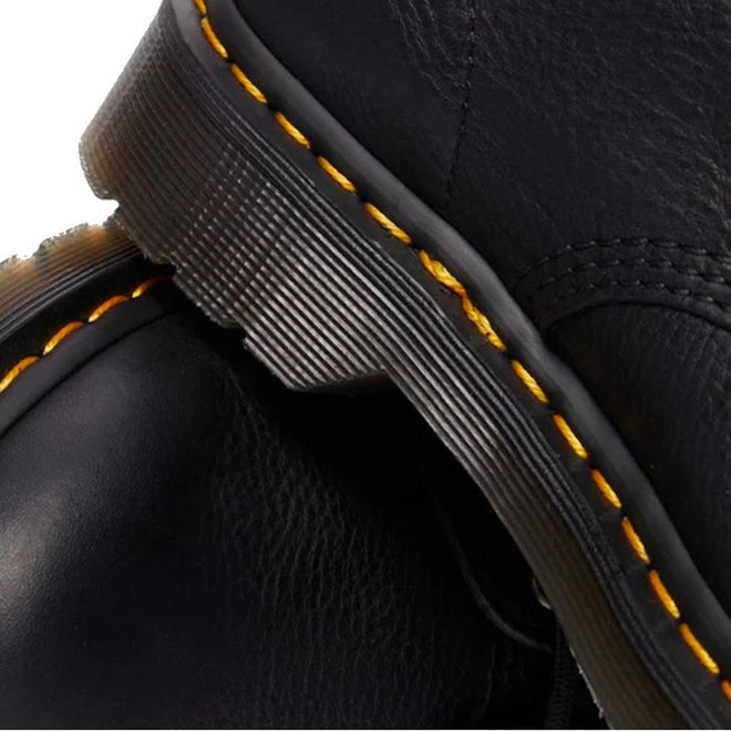 Close-up of Dr Martens 101 UB Black Ambassador 6 Eye Leather Boot, highlighting the thick sole, distinct yellow stitching, and textured black Ambassador leather. The focus is on the soft leather and signature stitching details., 190665693683, 190665693690, 190665693706, 190665693720, 190665693737, 190665693744, 190665693768, 190665693775