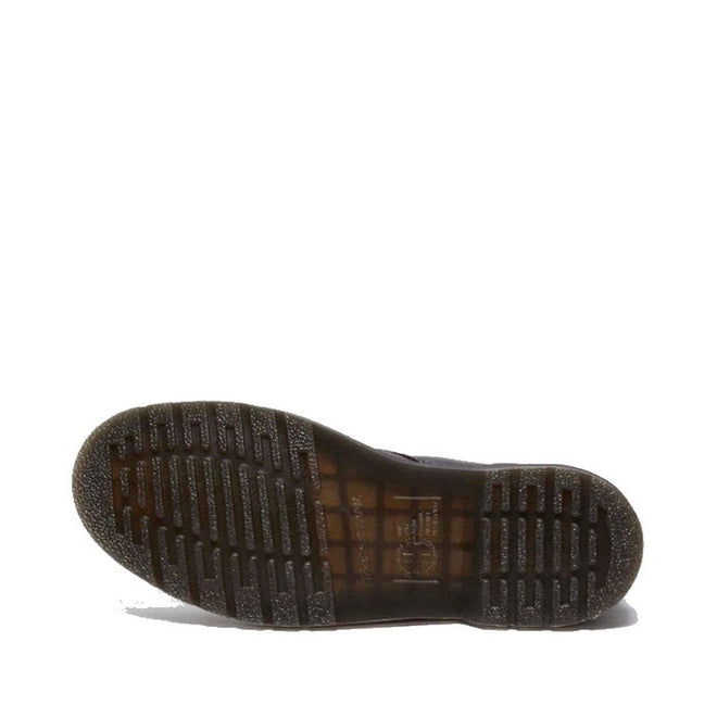 The image shows the bottom view of the Dr. Martens 101 UB Black Ambassador 6 Eye Leather Boot, highlighting its translucent brown rubber sole with ridged tread for grip against a plain white background., 190665693683, 190665693690, 190665693706, 190665693720, 190665693737, 190665693744, 190665693768, 190665693775