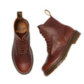 Flay lay of a pair of Dr Martens Cashew Ambassador leather boots. Showing the right foot top down and the left foot on the side. The pebbeld look of the leather is visable and the top of the boot cut off with no binding and the brass looking eyelets.,
190665662757,
190665662764,
190665662788,
190665662795,