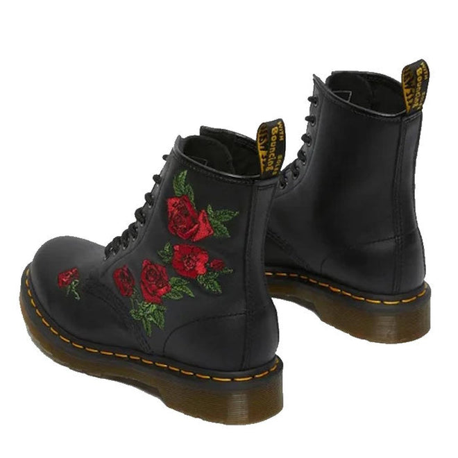 The Dr Martens 1460 Vonda Red Roses Softy T Leather Boot is a black boot with yellow stitching, red embroidered roses on the sides, signature AirWair Bouncing Soles, and yellow logo tags at the back., 190665206036, 190665206043, 190665206050, 190665206074, 190665206081, 190665206098