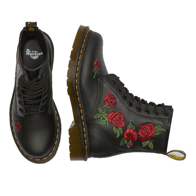 The Dr. Martens 1460 Vonda Red Roses Softy T Leather Boot features black leather, AirWair Bouncing Soles, yellow stitching, and red embroidered roses with green leaves, shown from top and side views on a white background., 190665206036, 190665206043, 190665206050, 190665206074, 190665206081, 190665206098