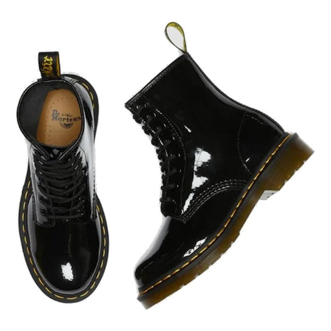 Dr Martens 1460 Black patent leather boots with yellow stitching. One foot side view and one foot top down on a white background.,
883985035249,
883985035256,
883985035270,