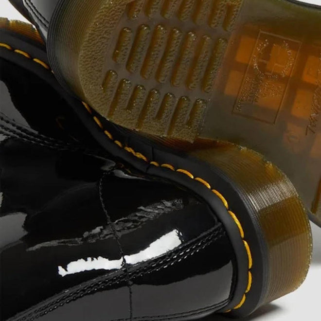 Close-up of black glossy Dr Martens 1460 Patent boots with yellow stitching and sole.
883985035249,
883985035256,
883985035270,
