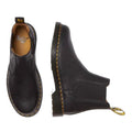 The Dr Martens 2976 Ambassador Black Leather Chelsea Boot, featuring Goodyear-welted construction, yellow stitching, and heel loops, is shown in side and top views on a white background., 50056, 50057, 50059, 190665663303, 190665663310, 190665663327, 50067, 50068