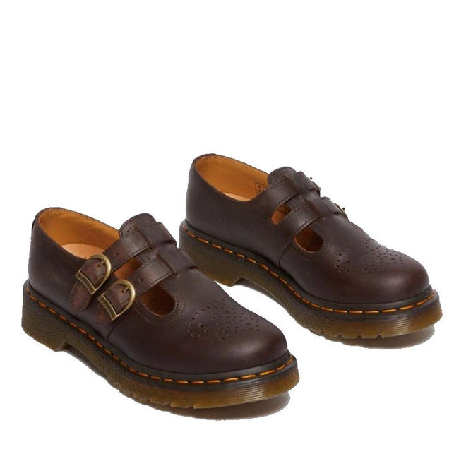 The Dr Martens 8065 2 Strap Mary Jane Shoe in Crazy Horse Brown features dual buckles, perforated toe detailing, thick ridged soles, and iconic yellow stitching., 190665588941, 190665588958, 190665588965, 190665588972, 13164654654, 190665588996, 190665589009, 190665589016