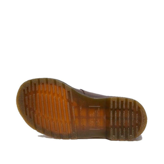 The image shows the bottom view of the Dr Martens 8065 2 Strap Mary Jane Shoe Crazy Horse Brown, featuring a dual buckle design and a translucent, textured rubber sole with horizontal grooves and tread for better grip., 190665588941, 190665588958, 190665588965, 190665588972, 13164654654, 190665588996, 190665589009, 190665589016