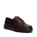 The Dr Martens Brookline Lo Dark Brown Crazy Horse Leather Shoe features a 3-eye design, black laces, metal eyelets, and a thick black rubber sole with signature yellow stitching around the edge.