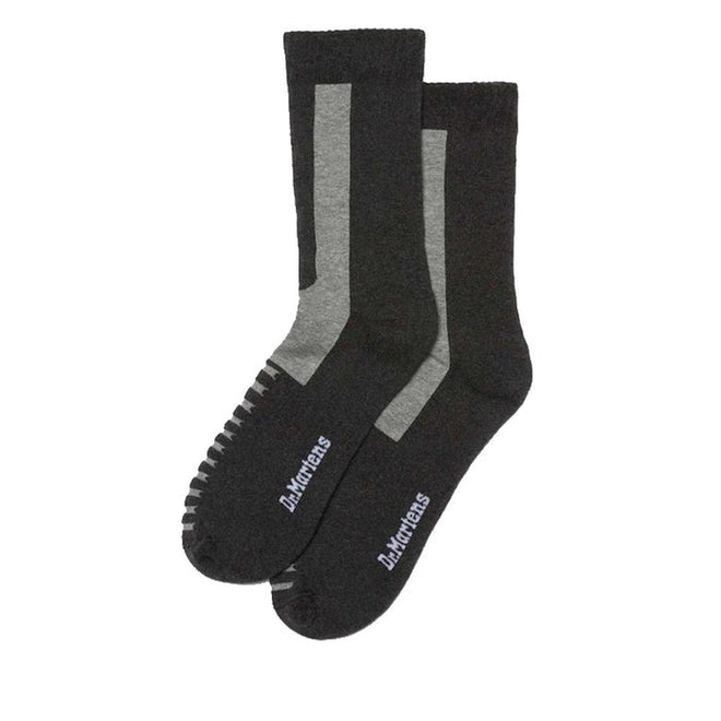 A pair of charcoal gray Dr. Martens socks with cushioned padding and arch support, displayed against a white background.