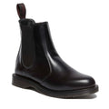 A Dr Martens Flora Womens finner fit , finner toed black polished smooth leather Chelsea boot with an elastic gusset and a low-profile grooved sole.