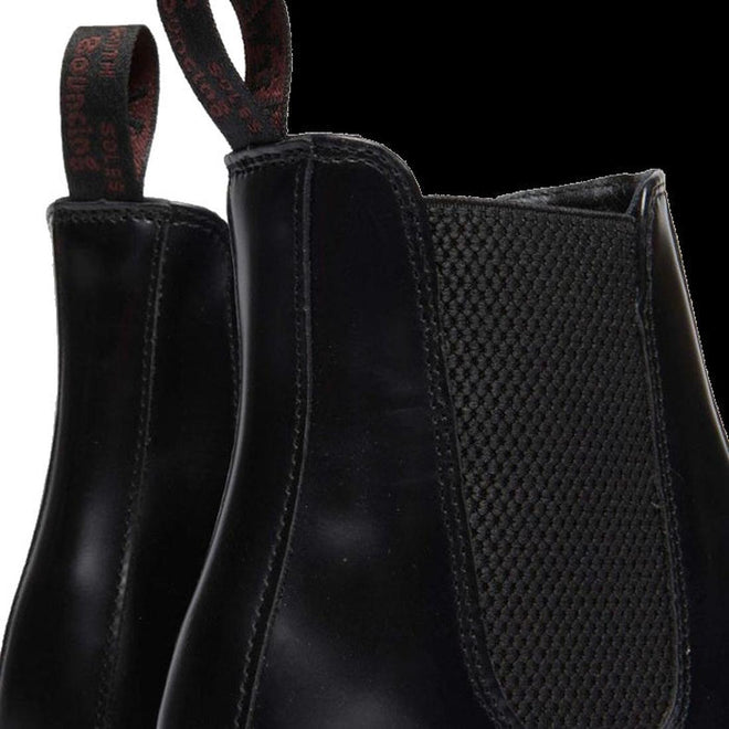 Close-up of Dr Martens Flora elastic gusset black leather ankle boots with textured side panel on a white background.,
190665698183,
190665698190,
190665698206,
190665698220,
190665698237,
190665698244,