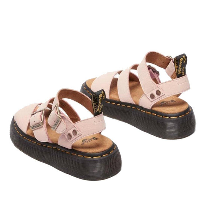 Pair of pink sandals Dr Martens Gryphon Quads showing the heel view looking forward with black soles on a white background,
190665714630,
190665714647,
190665714661,