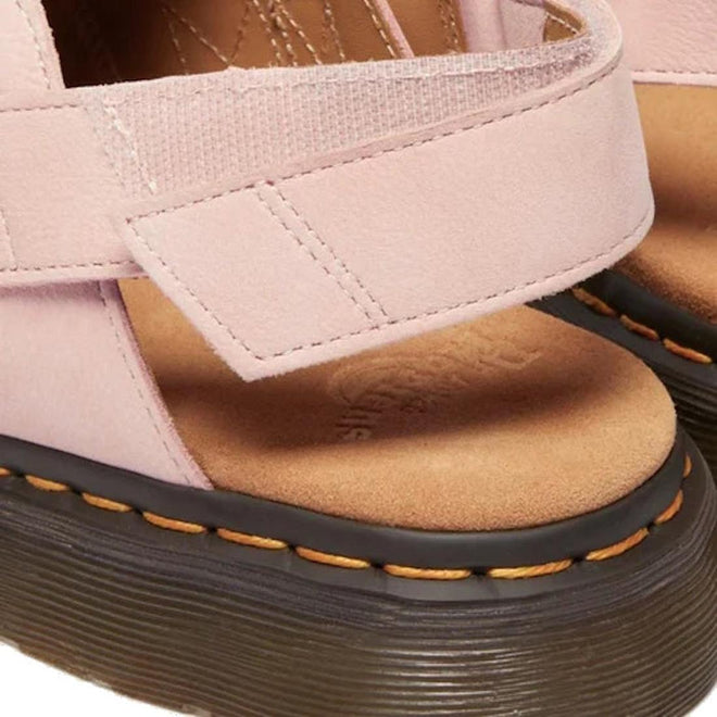Close-up of the heel velcro strap of Dr Martens Jorge Mule pink sandal with a brown sole and yellow stitching around the sole on a white background.,
190665705478,
190665705485,
190665705492,
190665705515,
190665705522,