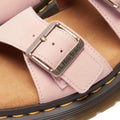 Close-up of a pink sandal with a buckle and brown insole, featuring the Dr. Martens logo. Dr Martens Josef Slide.,
190665707533,
190665707540,
190665707557,
190665707571,
190665707588,