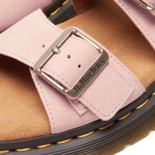 Close-up of a pink sandal with a buckle and brown insole, featuring the Dr. Martens logo. Dr Martens Josef Slide.,
190665707533,
190665707540,
190665707557,
190665707571,
190665707588,