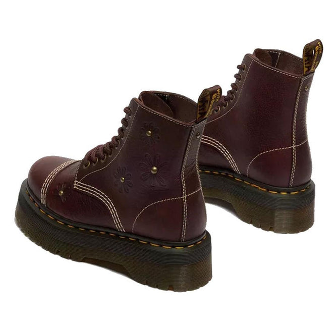 The Dr Martens Sinclair Flower Dark Brown Grizzly Leather Boot features floral embossing, yellow stitching, brown laces, and a thick black Quad platform sole. Shown from back and side angles on a white background., 51903, 51904, 190665777116, 190665777123, 190665777147, 51909, 51910