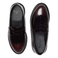 The Dr. Martens Temara Cherry Red Arcadia Leather Loafer features a classic penny design, glossy finish, Goodyear-welted build, and thick black soles for signature durability and style, shown here from above., 190665747560, 190665747577, 190665747591, 52060, 52061