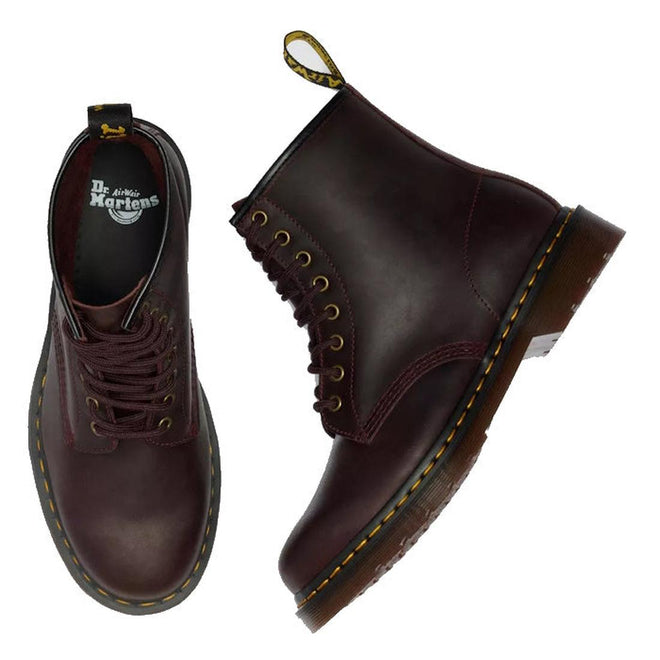 A pair of Dr Martens 1460 Cherry Red Crazy Horse Waxy Leather 8-eye boots—one upright showing the side profile and yellow stitching, the other displaying a top view with the brand logo inside., 190665786835, 190665786842, 190665786859, 190665786873, 190665786880, 190665786897, 190665786910, 50000, 50001, 50002