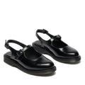 The Dr. Martens Madaline Black Smooth Women's Slingback Mary Jane Shoes feature shiny black polished leather, closed rounded toes, thick rubber soles, and adjustable buckle straps over the instep and heel.