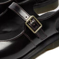 Close-up of Dr Martens Madaline Cherry Red Arcadia Women's Slingback Mary Jane Shoes with a silver buckle strap, Goodyear welted sole, and visible stitching in polished smooth leather.