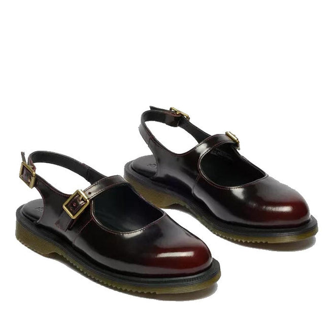 A pair of Dr Martens Madaline Cherry Red Arcadia Women’s Slingback Mary Jane shoes with open heels, gold buckles, chunky black soles with yellow stitching, made from Polished Smooth leather and Goodyear welted.