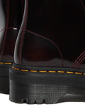 Close-up of the heel and back of two Dr Martens Sinclair Cherry Red Arcadia Leather Platform Boots, showing high-shine leather, yellow stitching, and thick black ridged soles. Detailed craftsmanship is clearly visible., 51252, 190665278637, 190665278644, 190665278668, 51256