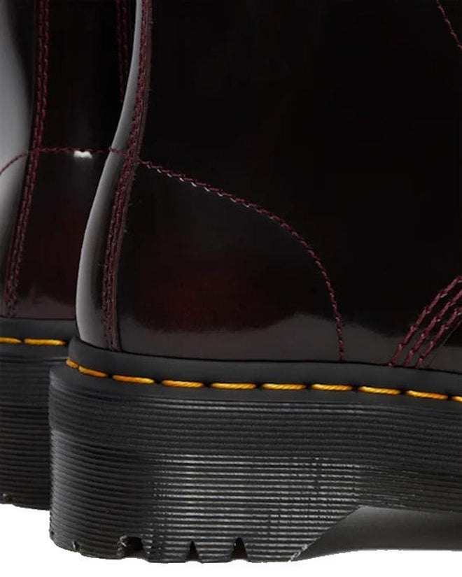 Close-up of the heel and back of two Dr Martens Sinclair Cherry Red Arcadia Leather Platform Boots, showing high-shine leather, yellow stitching, and thick black ridged soles. Detailed craftsmanship is clearly visible., 51252, 190665278637, 190665278644, 190665278668, 51256