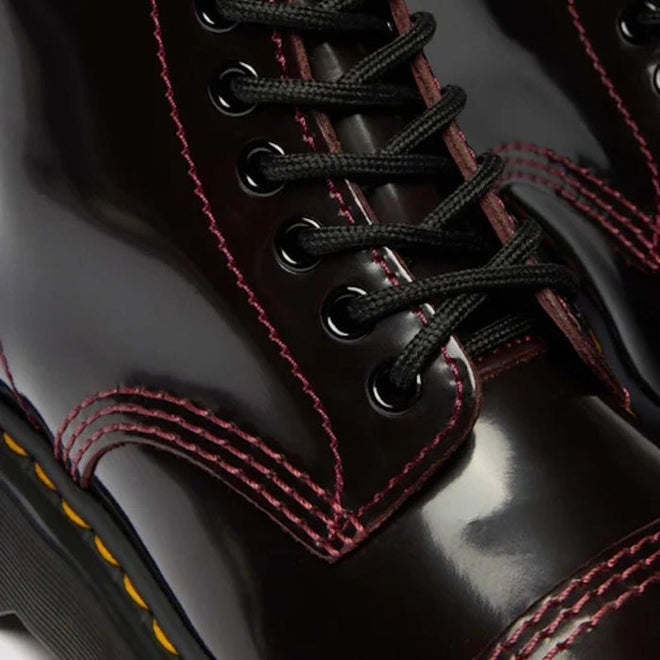 Close-up of the Dr Martens Sinclair Cherry Red Arcadia Leather Platform Boot, featuring high-shine leather, black laces and eyelets, with bold pink and yellow stitching along a thick rubber sole for a standout look., 51252, 190665278637, 190665278644, 190665278668, 51256