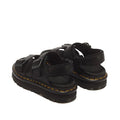 Dr Martens Zebzag Black Pisa Leather 3 Strap Sandal featuring black three-strap styling, thick lug soles, and yellow stitching along the air-cushioned welt.