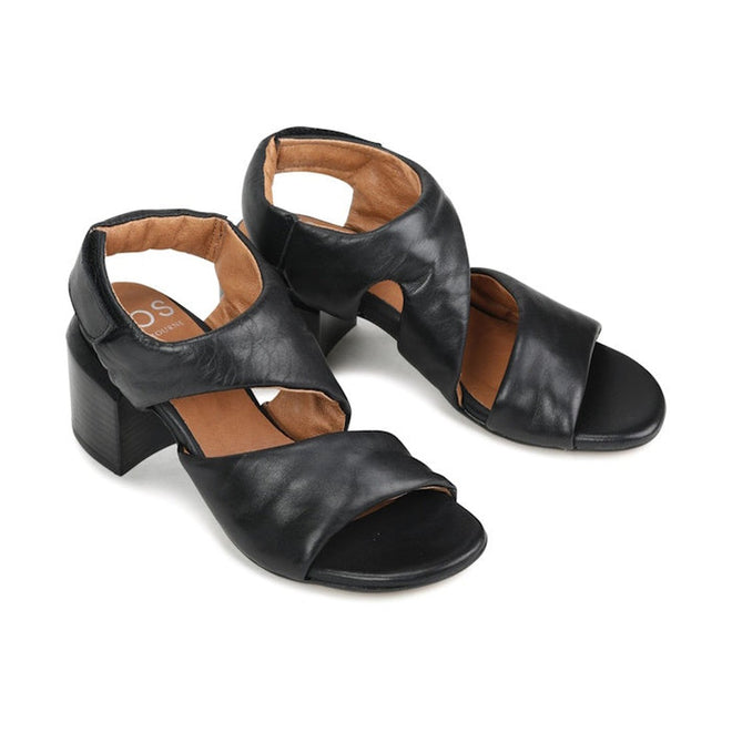 The EOS Charbel Black Leather Block Heel Women's Sandals feature open toes, crisscross black leather straps, and a cushioned tan insole, shown against a white background., 41229, 9321191240237, 9321191240244, 9321191240251, 9321191240268, 9321191240275