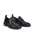 Pair of black leather penny loafer style shoes with a small heel on a white background,
9321191190532,
9321191190549,
9321191190556,
9321191190563,
9321191190570,, 9321191190532, 9321191190549, 9321191190556, 9321191190563, 9321191190570