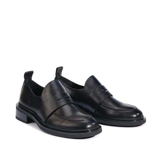 Pair of black leather penny loafer style shoes with a small heel on a white background,
9321191190532,
9321191190549,
9321191190556,
9321191190563,
9321191190570,, 9321191190532, 9321191190549, 9321191190556, 9321191190563, 9321191190570