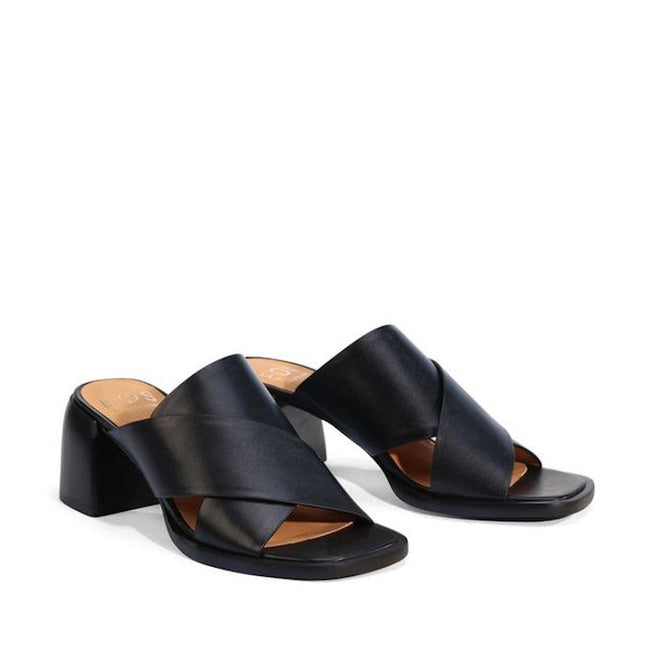 The EOS Iso Black Leather Heeled Sandal features wide crisscross straps and an open toe design in black cashmere leather, set on a block heel and shown against a white background., 9321191306735, 9321191306742, 9321191306759, 9321191306766, 9321191306773