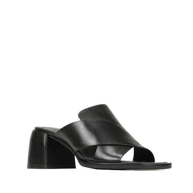 The EOS Iso Black Leather Heeled Sandal features black cashmere leather, wide crisscross straps, an open toe, and a chunky mid-height block heel, shown against a plain white background.