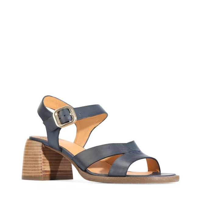 The EOS Isoken Navy Leather Heeled Women's Sandal features two straps, an adjustable buckle, an open toe, and a low block heel. Displayed against a white background.