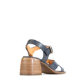 The EOS Isoken Navy Leather Heeled Women's Sandal features navy strappy leather, a medium stacked wooden heel, and gold buckle, shown from the back and side on a white background., 9321191307084, 9321191307091, 9321191307107, 9321191307114, 9321191307121