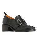 Black leather loafer shoe with heel with a circular linked accessory over the top of the foot on a white background