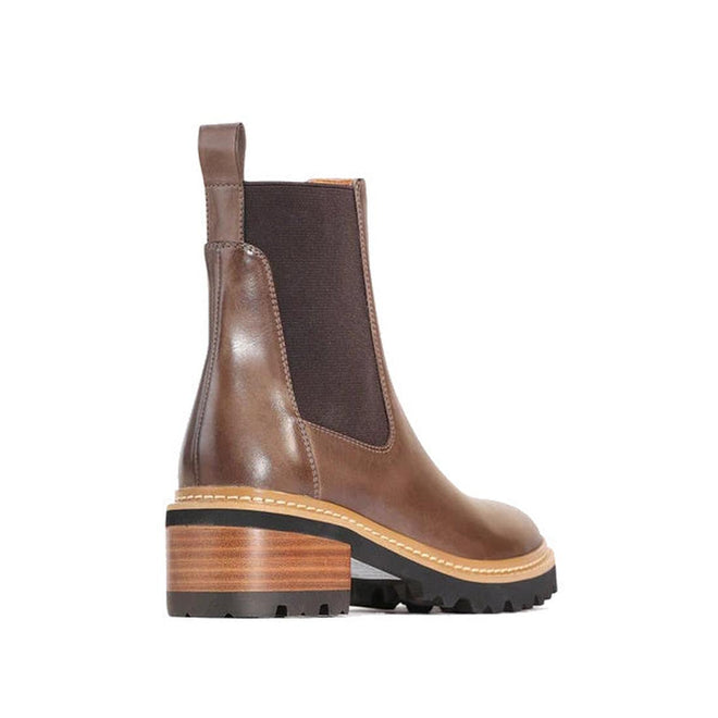 EOS Linear women’s boot in Brown leather with side gussets, block heel, and lugged sole. Side View of Right Foot taken from the heel showing heel detailing.