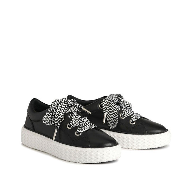 The EOS Trinsic Black Leather Lace Up Trainer features thick white soles and bold black-and-white zigzag laces, crafted from premium cashmere leather, shown on a white background., 36520, 9321191200897, 9321191200903, 9321191200910, 9321191200927, 9321191200934, 36526