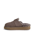 A single Emu Womens Adison Smoke Grey Wool Mule Slipper Scuff with a fluffy gray sheepskin lining and a thick tan rubber sole, viewed from the side against a white background., 50716, 9330071986417, 9330071986424, 9330071986431, 50720, 50721