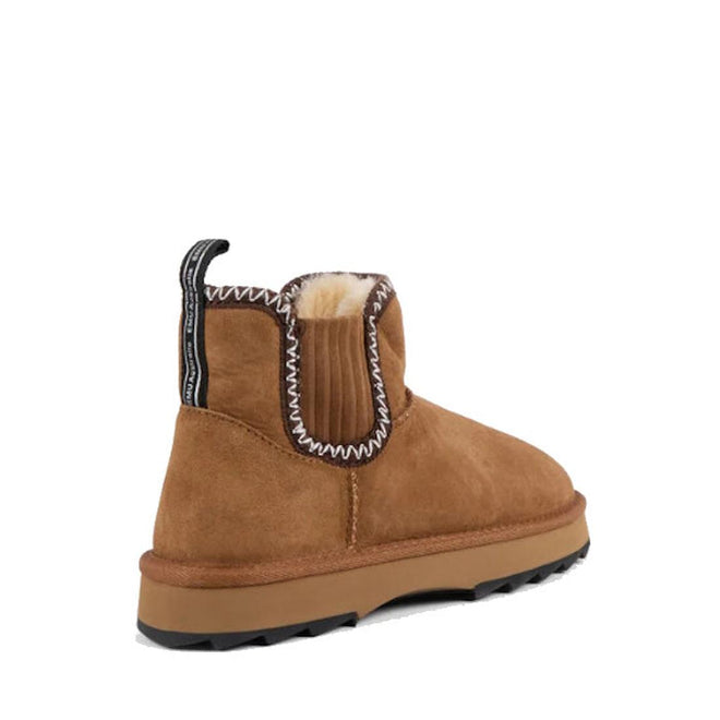The Emu Womens Higgie Chestnut Platform Wool Boot is shown from an angled rear view, crafted from water-resistant Australian sheepskin in brown suede with a light brown sole, visible fur lining, white zigzag stitching, and a black heel pull tab., 9330071978580, 9330071978597, 50686