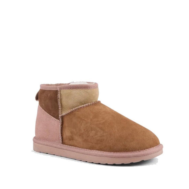 The EMU Stinger Micro Patchwork Sheepskin Chestnut Wool Boot features brown and pink suede panels, visible stitching, a pink sole, and a water-resistant finish inspired by classic Australian sheepskin boots.