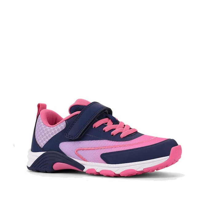 The Harrison Nifty Kids School Sports Trainer in Navy/Lilac features a velcro strap, pink laces, mesh panels, breathable lining, and a white and pink sole. The shoe is displayed on a white background.