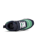 The Harrison Nifty Kids Sports Trainer in navy, green, and white features mesh and breathable leather uppers, a durable rubber sole, white laces with a velcro strap for adjustable fit, and is shown from above., 49664, 9361913035710, 9361913035734, 9361913035758, 9361913035772, 9361913035796, 9361913035819, 9361913035833, 49672, 49673, 49674