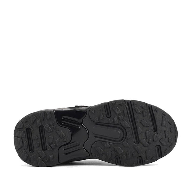 The image displays the black rubber sole of the Harrison Nifty Black School Trainer, featuring a textured tread pattern with varied shapes for improved grip and traction, combining rugged design with both smooth and raised areas., 48569, 48570, 48571, 9361913034997, 48573, 9361913035031, 48575, 48576, 48577, 48578, 48579, 48569, 48570, 48571, 9361913034997, 48573, 9361913035031, 9361913035055, 9361913035079, 48577, 9361913035116, 48579