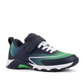 The Harrison Nifty Kids Sports Trainer in navy, green, and white features breathable leather uppers, white laces, a Velcro strap for an adjustable fit, heel pull tab, and a sporty design with a white and black sole.